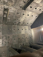 Covering with protection of the working chamber of the shot blaster